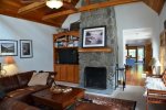 Living Room with Wood Burning Fireplace & Flat Screen TV at Saltwater Snug